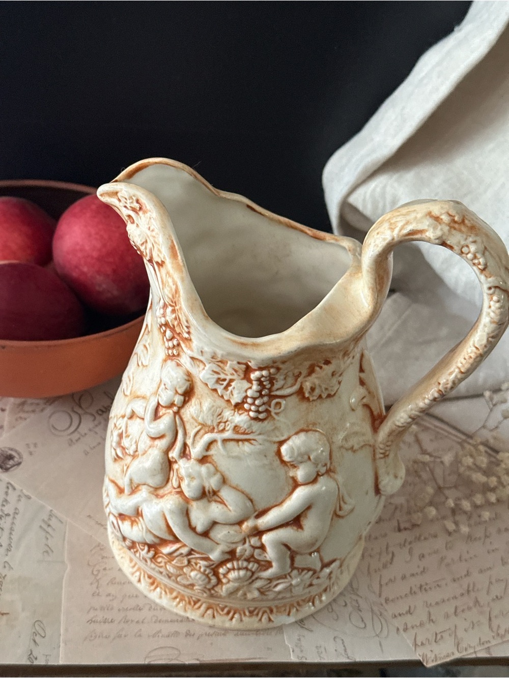 Ornate Cream Ceramic Pitcher with Cherub Relief - Cream